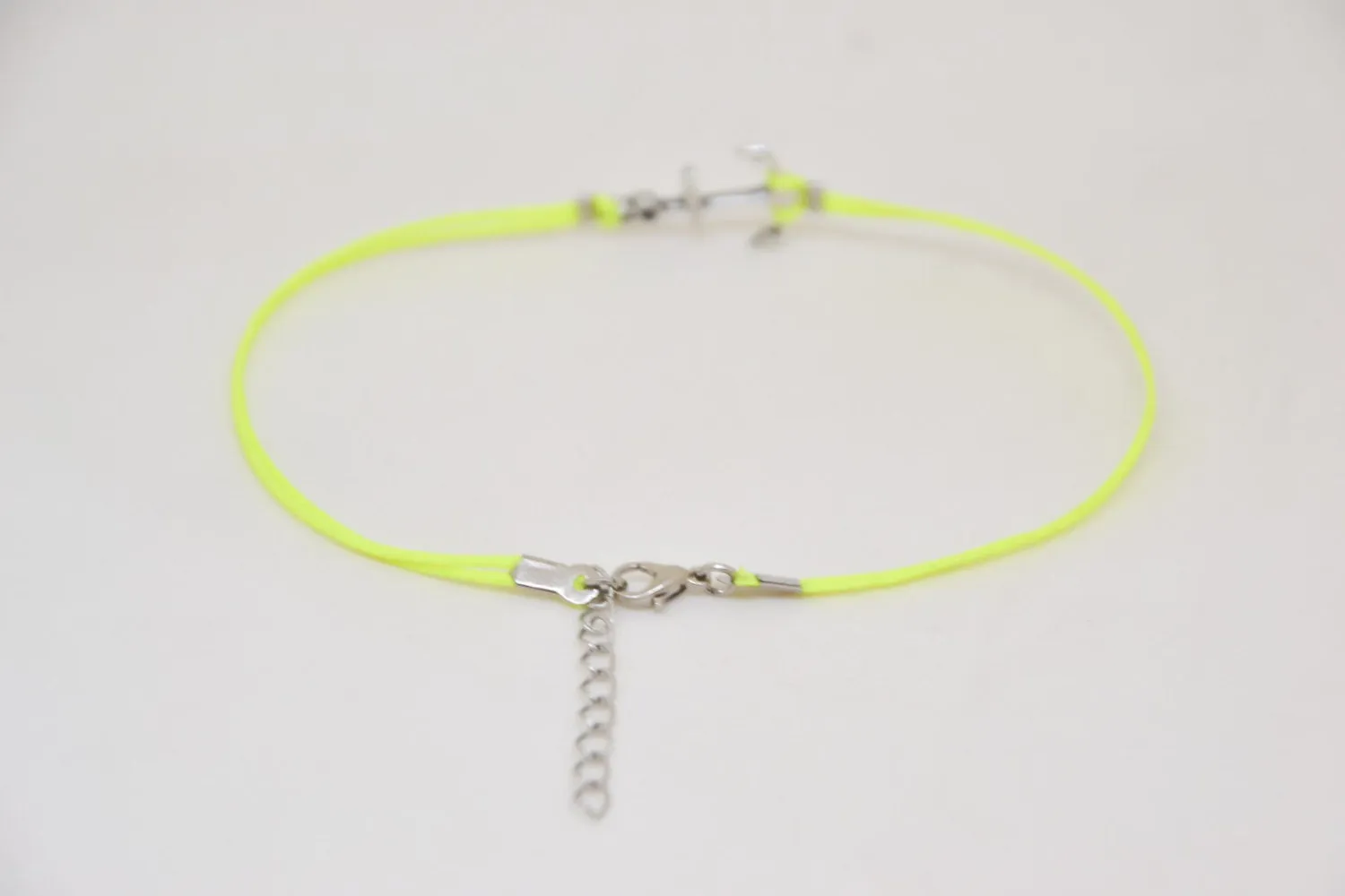 Neon yellow anklet with a silver anchor charm, ankle bracelet